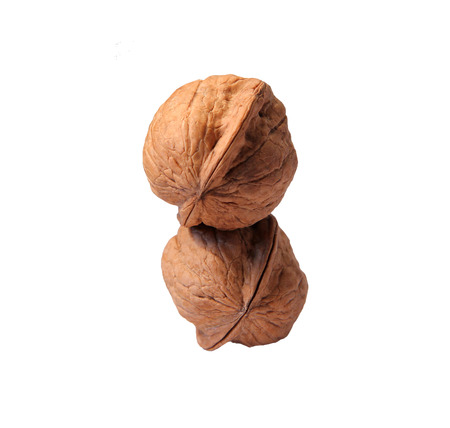 two whole yellow nut one above the other
