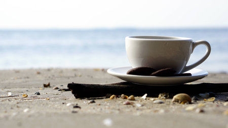 Espresso coffee on the beach. A cup of latte, cappuccino or espresso coffee on the sand.の写真素材