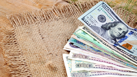 US dollars, Korean Won, Euro bills and some money bills and banknotes. Currency foreign exchange. Business and Financial or money management for investments.の写真素材