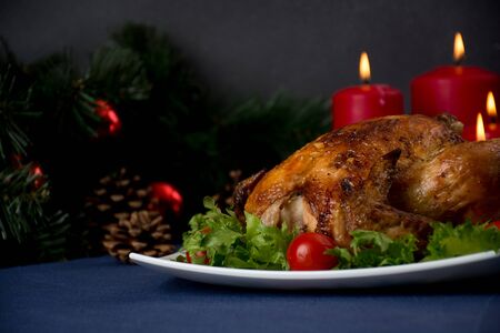Roasted chicken for christmas table, christmas decorationの写真素材