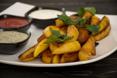 Fried potato with three different kind of saucesの写真素材