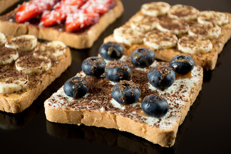 Sweet sandwiches with fresh berries fo breakfastの写真素材