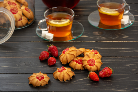 Tea and cookies with strawberry jelly for two personの写真素材