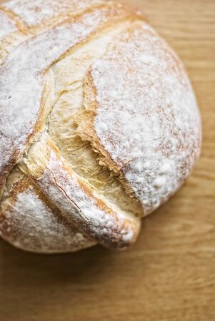 Round bread on wooden backgroundの写真素材