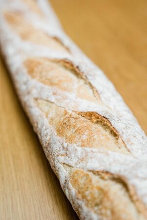 French baguette on wooden tableの写真素材
