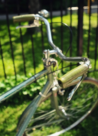 An old-fashioned green vintage bike handlebarsの写真素材