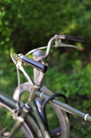 An old-fashioned green vintage bike handlebarsの写真素材