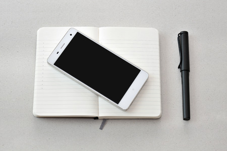 Smart phone, notebook, and pen, isolated