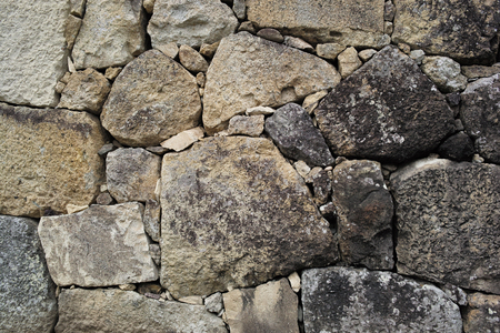 Background of an ancient stone wallの写真素材