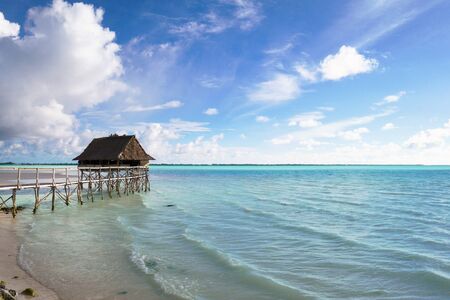Small hut on a sunny day and blue sky, Kiribati, Micronesia in the central Pacific Oceanの写真素材