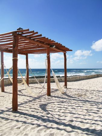 Nothing beats a warm breeze by the ocean relaxing in a hammockの写真素材