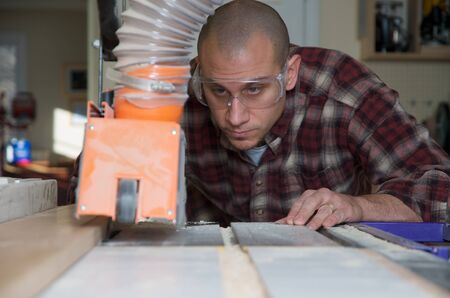 Woodworker working on table saw