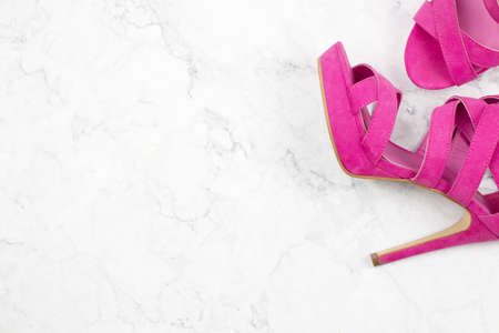 pink high heels on marble background, flat lay, fashion conceptの写真素材