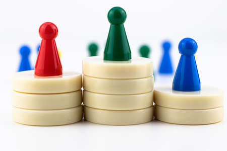 Leadership concept. Colorful chess pawns on white background.の写真素材