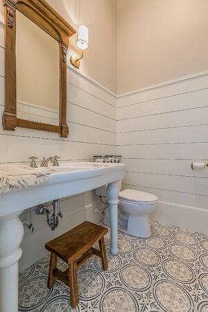 Shiplap walls in bathroom with beautiful flooringの写真素材