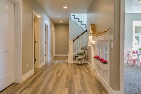 Hallway leading to stairs in beautiful basement of homeの写真素材