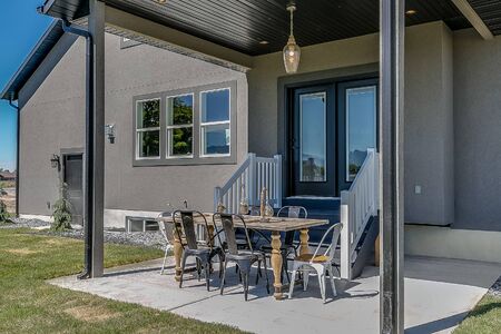 French glass doors leading out to small covered patio