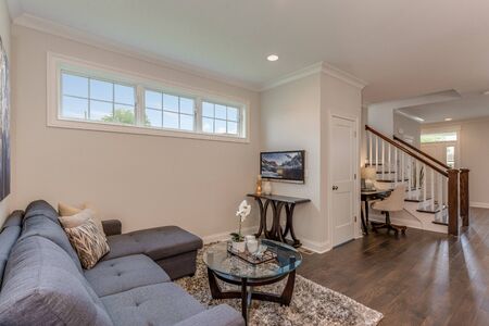 The keeping room is a perfect gathering space off the kitchen with sunny awning windows