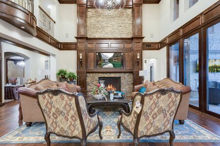 Expansive and elegant living room with lots of windows to enjoy the viewの写真素材