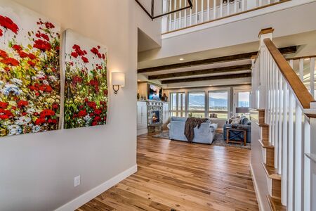 Welcoming front entry with stairs and hallway to family roomの写真素材
