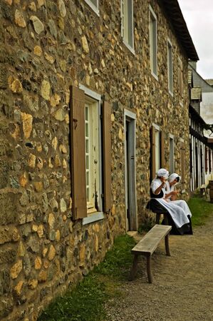 Girls of Louisbourg taking a quick break to have a talkの写真素材