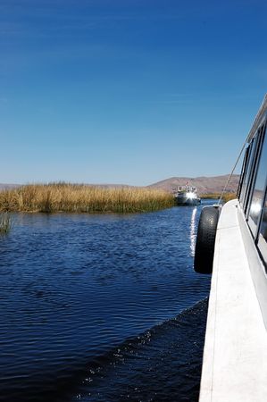 Lake Titicaca and the reeds from the side of a boatの写真素材