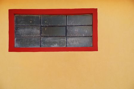 Red window on a colonial style build in Puno. Peruの写真素材