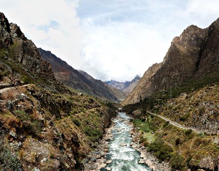 Andes mountain range and river at the entrance to the Inca Trailの写真素材