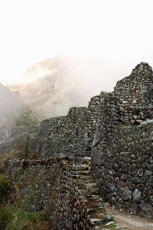 Ancient Inca steps with ruins in the backgroundの写真素材