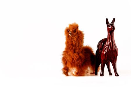 isolated toy llamas with real fur and woodの写真素材