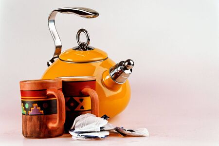 isolated tea pot with handmade mugsの写真素材