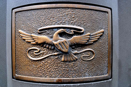 bird sign decor at gray concrete doorの写真素材