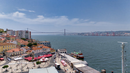 Just 15 minutes by ferry from Lisbon, Cacilhas offers stunning riverside views, seafood restaurants, street art, and access to Cristo Reiの写真素材