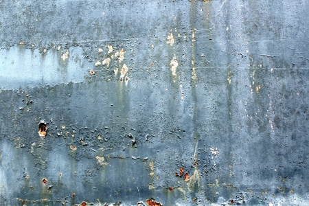  Fragment of an damaged old wall with a showered paint  