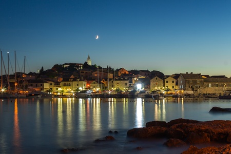 Illuminated "Primosten" by night, Croatia, on the Adriatic seaの写真素材