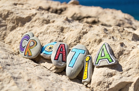 Croatia inscription arranged with colorful painted letters on the stonesの写真素材