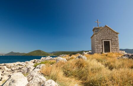Small old stone church on island in Klek, Dalmatia, Croatia, Europeの写真素材