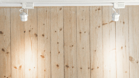 Wood wall with spotlight hanging backgroundの写真素材