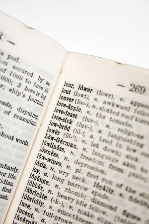 Old Dictionary, pages with words, short DOF shot in RAW with 4x Closeup Filter, this thing is only like 2" tall, used to be my mum's and it later had a distressing time while I burned it with a magnifying glass as a kid :Dの写真素材