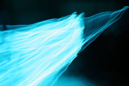 Photographs of 'Glow Wire' being shaken and moved in the darknessの写真素材