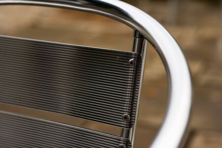 Abstract metal Chair outside a caféの写真素材