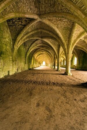 Vaulted ceilings in Fountains Abbey in North Yorkshire, shot with natural lighting from Tripod with 10-20mm lens.
Old broken down abbey and surounding grounds. Ancient Gothic archesの写真素材