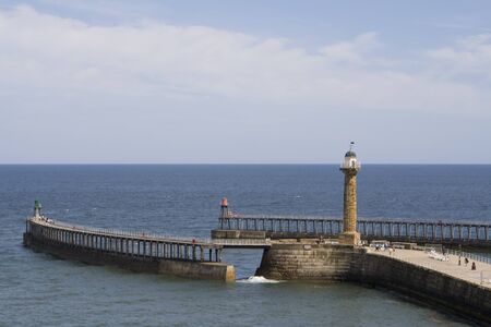 Whitby Harbour on summer day, looking out to sea. North Yorkshire, UKの写真素材