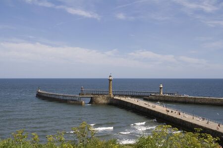 Whitby Harbour on summer day, looking out to sea. North Yorkshire, UKの写真素材