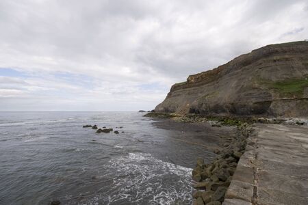 View from Whitby harbour sea wall, North Yorkshire Tourist destination. Shot with a 10mm wide angle lens.の写真素材