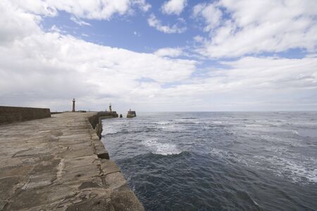 View from Whitby harbour sea wall, North Yorkshire Tourist destination. Shot with a 10mm wide angle lens.の写真素材