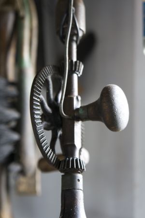 Old Hand drill with shallow depth of field, old woodworking tool.の写真素材