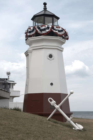 This lighthouse reflects the airy freedom of summer and the lakeside or coastal areas surrounding them. Soft colors and beautiful intricacy will add coastal cool and nautical to any collection.の写真素材