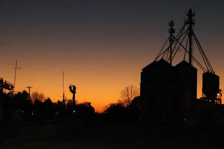 This picture is a representation of the end of a long day in Rural America. Long days spent working at the many and countless agriculture farms and facilities in our country.の写真素材