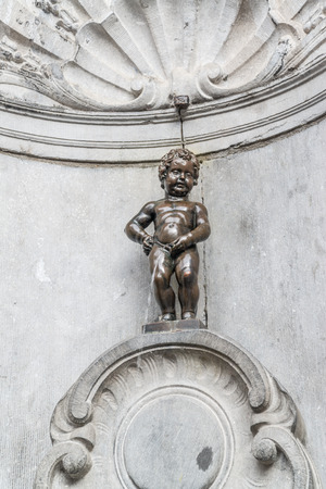 Manneken Pis statue in Brussels. Statue of a pissing boy in a beautiful summer day in Brussels, Belgiumのeditorial素材